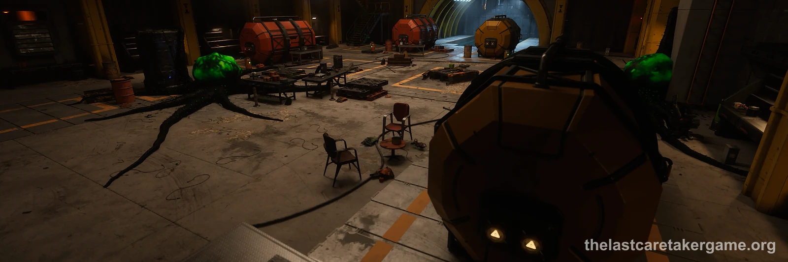 The hall of a warehouse inside a vault, with fuel tanks, a tunnel and a large round robot in front, in The Last Caretaker, from the Update 5.5 press kit; no QR code is shown.
